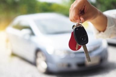 vecteezy_the-car-owner-is-standing-the-car-keys-to-the-buyer-used_19568694_903.jpg