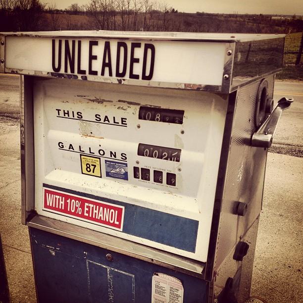 A gas pump with a sign that reads: 10% ethanol.
