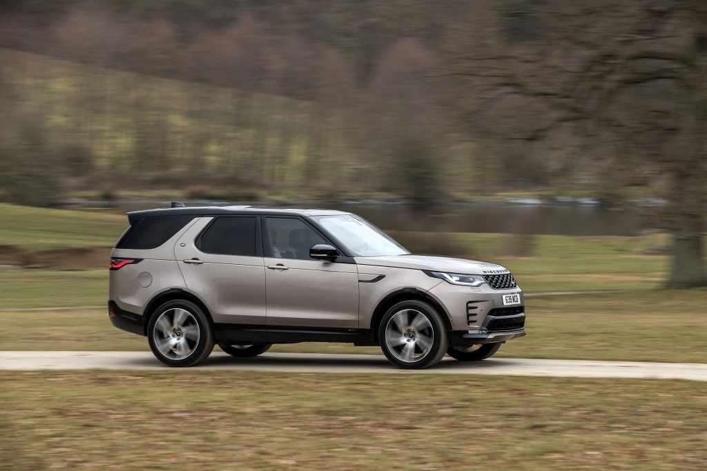 A 2021 Land Rover Discovery driving down a road.