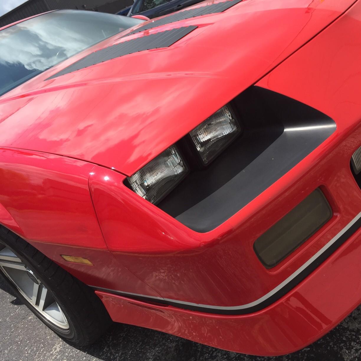 the front of a red camaro 
