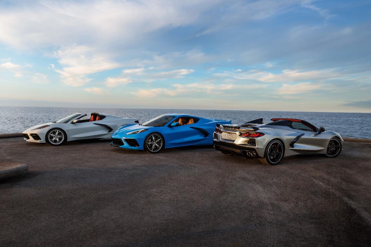 Three 2021 Chevrolet Corvette Stingray Coupe Convertibles outside by water