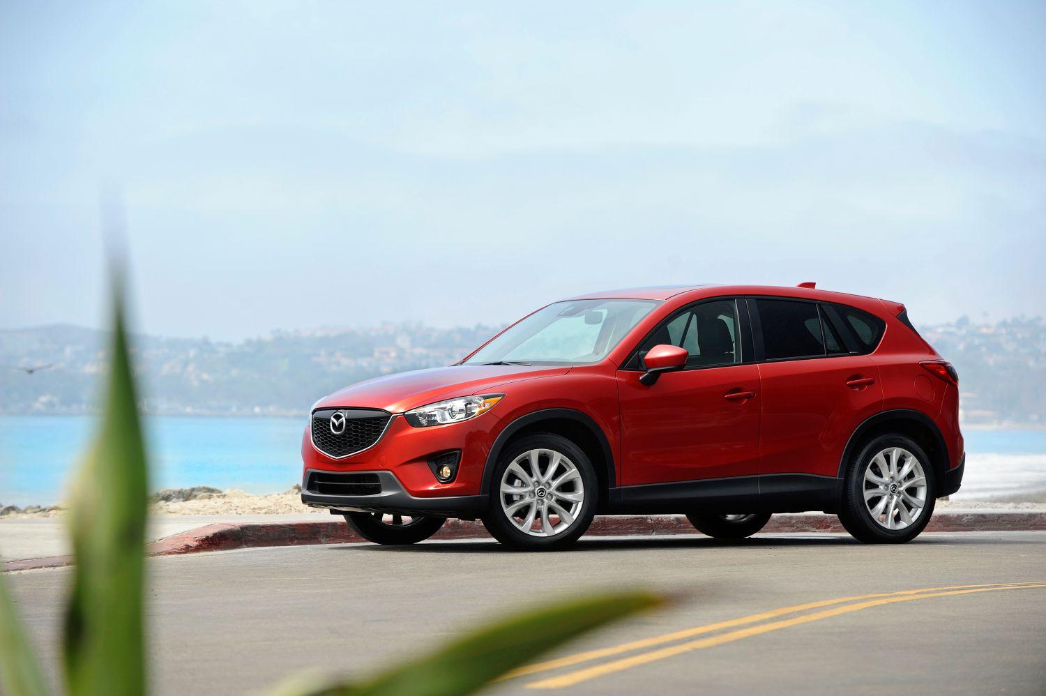 A red 2015 Mazda CX-5 on display.
